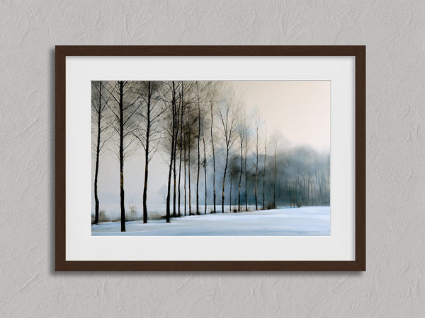 Bare winter trees fading into blue-grey mist across a quiet snow-covered landscape.