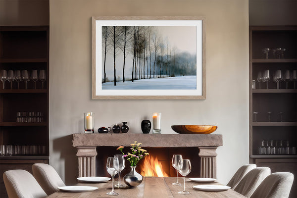 Bare winter trees fading into blue-grey mist across a quiet snow-covered landscape.