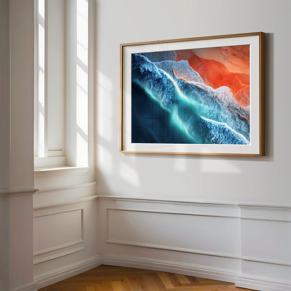 Close wall view of Ember Tide coastal artwork in a light wood frame with white matting.