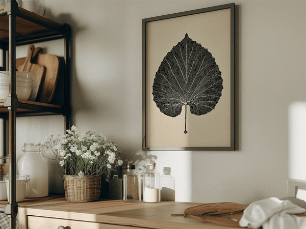 Framed botanical print of a single aspen leaf in fine line art. Minimalist, organic wall decor with timeless natural elegance.