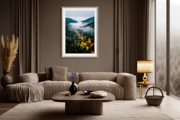 Framed fine art print of a misty valley in fall colours. Red, gold, and evergreen forest hues captured in a vivid autumn woodland scene.