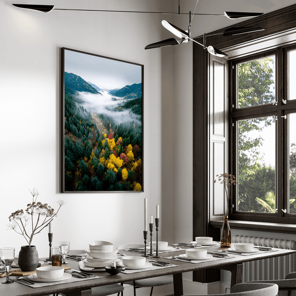 Framed fine art print of a misty valley in fall colours. Red, gold, and evergreen forest hues captured in a vivid autumn woodland scene.