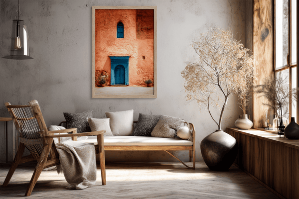 Framed Moroccan street scene art print featuring a vivid blue doorway and ochre wall. A soulful, timeless piece for eclectic interiors.