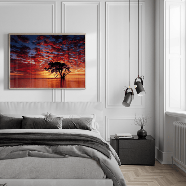 Framed wall art of a solitary ocean tree at sunrise. A serene fine art print capturing dawn’s quiet light over sea and sky.