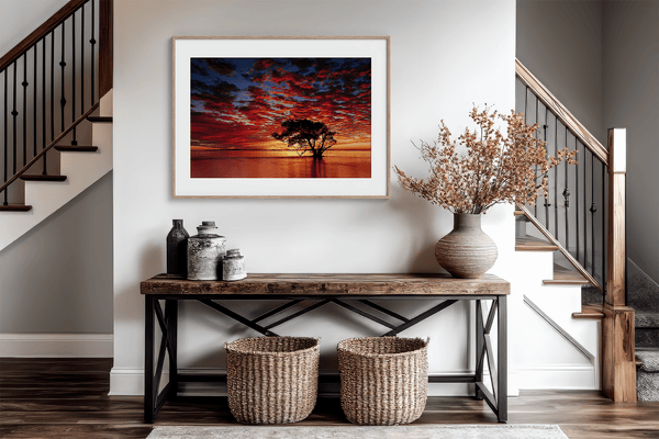 Framed wall art of a solitary ocean tree at sunrise. A serene fine art print capturing dawn’s quiet light over sea and sky.