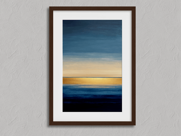 Framed wall art of an abstract seascape in deep indigo, blue, and gold. A minimalist horizon print evoking calm and renewal.