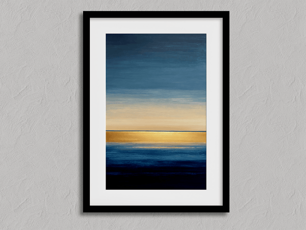 Framed wall art of an abstract seascape in deep indigo, blue, and gold. A minimalist horizon print evoking calm and renewal.