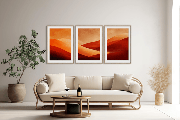 Framed desert sunset triptych wall art in warm red and amber tones. A soft, minimalist watercolour print that brings warmth and calm.