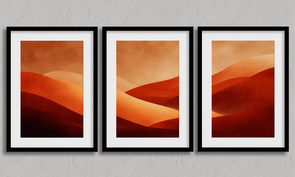 Framed desert sunset triptych wall art in warm red and amber tones. A soft, minimalist watercolour print that brings warmth and calm.