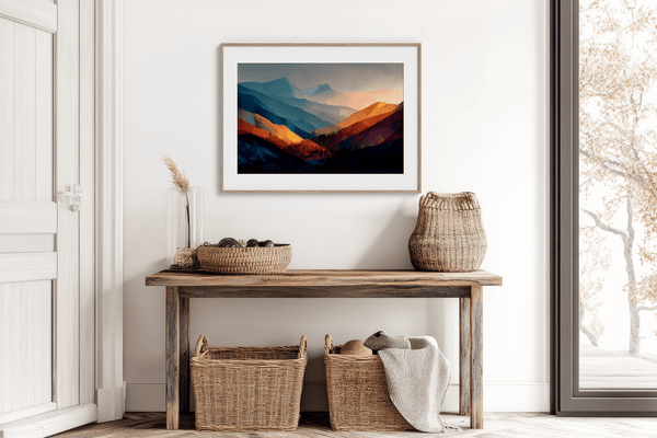 Framed wall art of layered mountains in twilight tones. Deep blues and sienna hues bring bold calm.