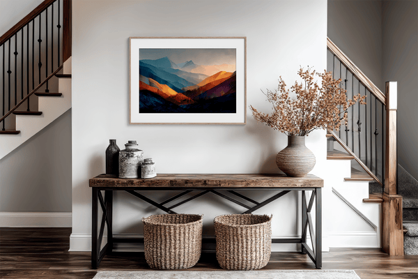 Framed wall art of layered mountains in twilight tones. Deep blues and sienna hues bring bold calm.
