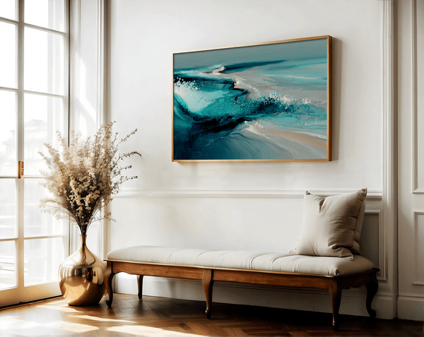 Framed wall art of abstract ocean waves in deep indigo, teal, and white. A calming coastal piece that’s ready to hang.