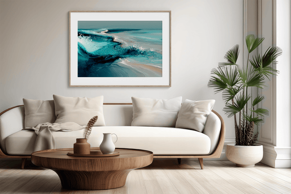 Framed wall art of abstract ocean waves in deep indigo, teal, and white. A calming coastal piece that’s ready to hang.