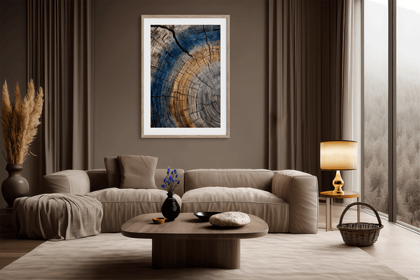 Framed fine art print of tree ring textures in warm browns and cool blues. A striking, timeless piece of nature-inspired wall art.