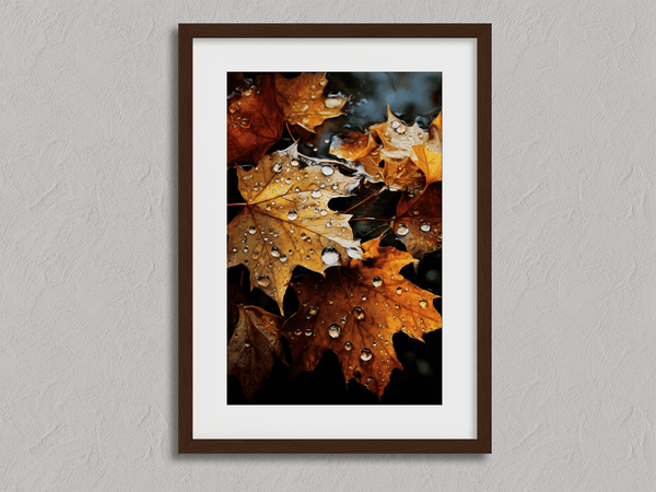 Framed wall art of crimson, amber, and sienna maple leaves with glistening droplets. A radiant autumn foliage print. Ready to hang.
