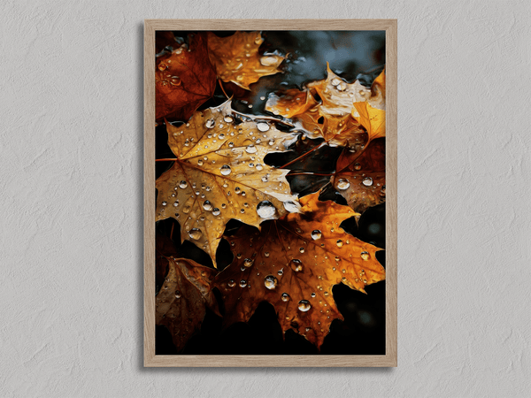 Framed wall art of crimson, amber, and sienna maple leaves with glistening droplets. A radiant autumn foliage print. Ready to hang.