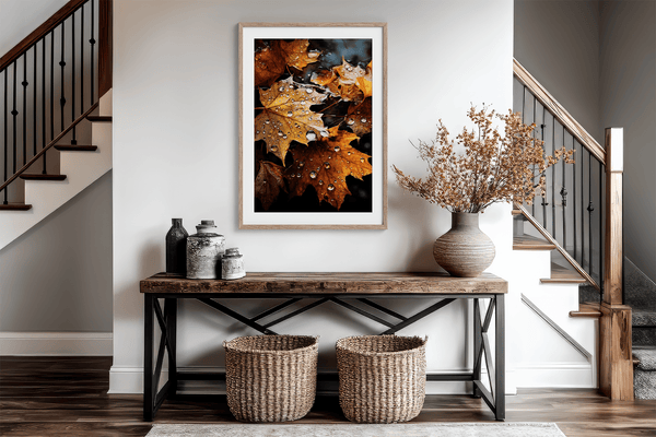 Framed wall art of crimson, amber, and sienna maple leaves with glistening droplets. A radiant autumn foliage print. Ready to hang.