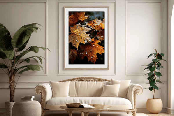 Framed wall art of crimson, amber, and sienna maple leaves with glistening droplets. A radiant autumn foliage print. Ready to hang.