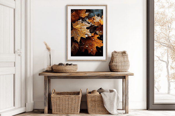 Framed wall art of crimson, amber, and sienna maple leaves with glistening droplets. A radiant autumn foliage print. Ready to hang.