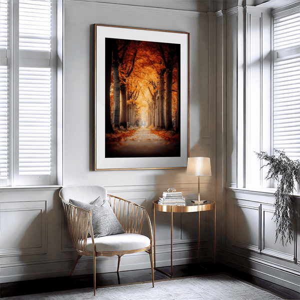 Framed wall art of a tree-lined autumn path beneath golden leaves. A nostalgic woodland print in warm light. Ready to hang.