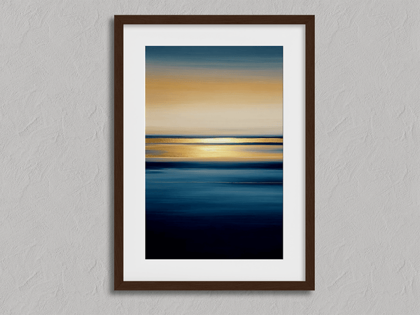 Framed wall art of an ocean sunset in coral, peach, and blue tones. A timeless abstract seascape print. Ready to hang.