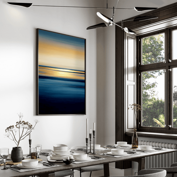 Framed wall art of an ocean sunset in coral, peach, and blue tones. A timeless abstract seascape print. Ready to hang.