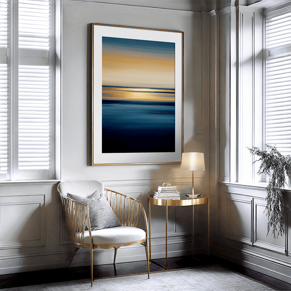 Framed wall art of an ocean sunset in coral, peach, and blue tones. A timeless abstract seascape print. Ready to hang.