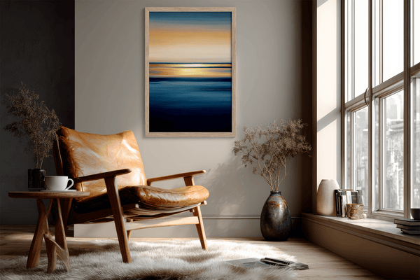 Framed wall art of an ocean sunset in coral, peach, and blue tones. A timeless abstract seascape print. Ready to hang.