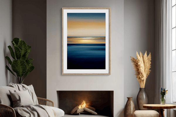 Framed wall art of an ocean sunset in coral, peach, and blue tones. A timeless abstract seascape print. Ready to hang.