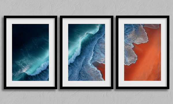 Coastal triptych framed wall art of teal waves and sienna sands. Framed or unframed ocean prints for serene, modern interiors.