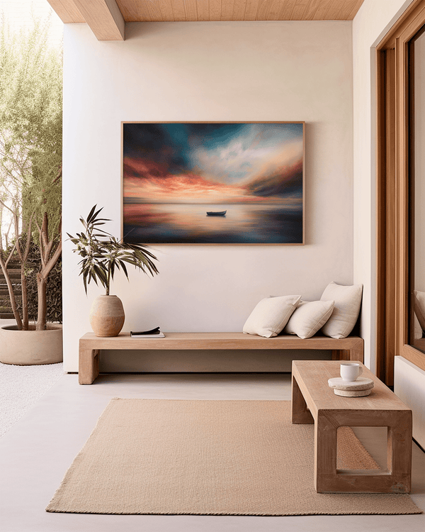Framed canvas wall art of a glowing sunset and solitary boat. A calm seascape in warm hues, ready to hang.