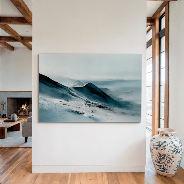 Framed canvas wall art of snowy peaks in soft watercolour blues and greys. A calm, minimalist mountain print. Ready to hang.