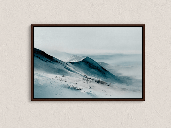 Framed canvas wall art of snowy peaks in soft watercolour blues and greys. A calm, minimalist mountain print. Ready to hang.