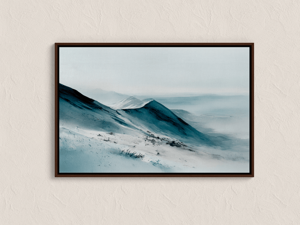 Framed canvas wall art of snowy peaks in soft watercolour blues and greys. A calm, minimalist mountain print. Ready to hang.