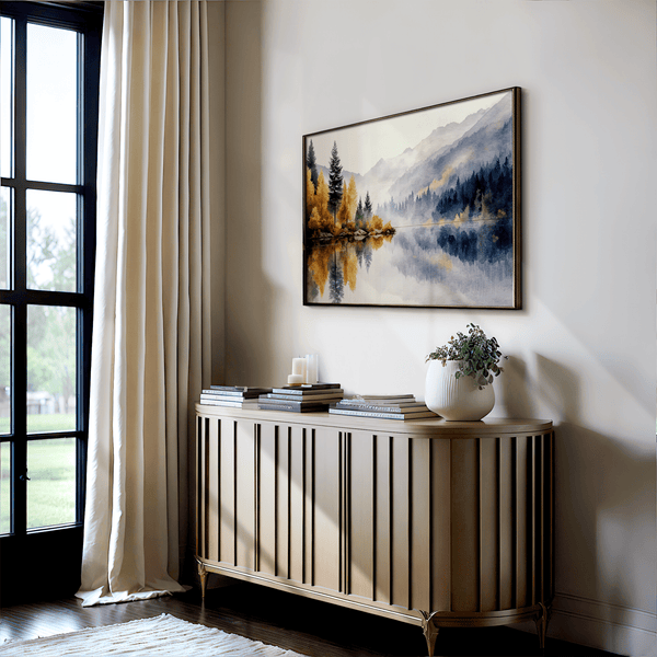 Framed wall art of a calm river reflecting golden trees and hills. An autumnal piece full of stillness and warmth. Ready to hang.