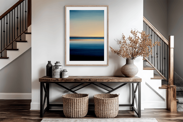 Framed wall art of a minimalist ocean horizon in pale blues and pastels. A serene abstract seascape print. Ready to hang.