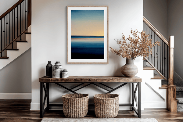 Framed wall art of a minimalist ocean horizon in pale blues and pastels. A serene abstract seascape print. Ready to hang.