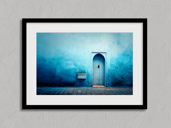 Framed fine art print of a Moroccan blue doorway. Minimalist travel-inspired wall art full of calm, texture, and timeless charm.