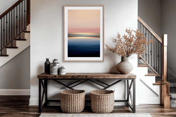 Framed wall art of a soft watercolour ocean sunrise in pastel tones. A calm, minimalist seascape print. Ready to hang.
