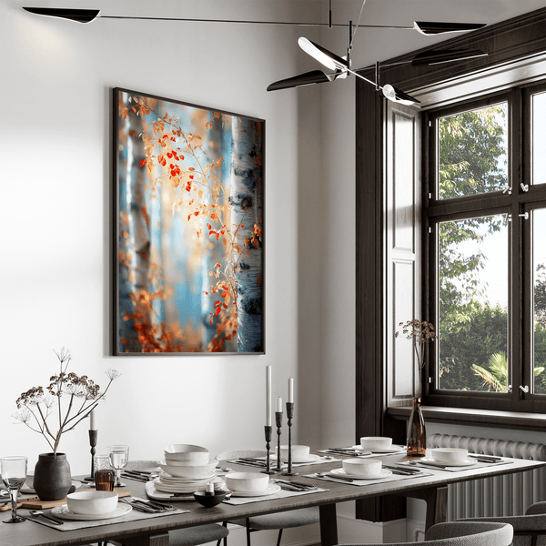 Framed wall art of birch trees in soft autumn light. Crimson and amber leaves drift in golden calm. A tranquil seasonal print.