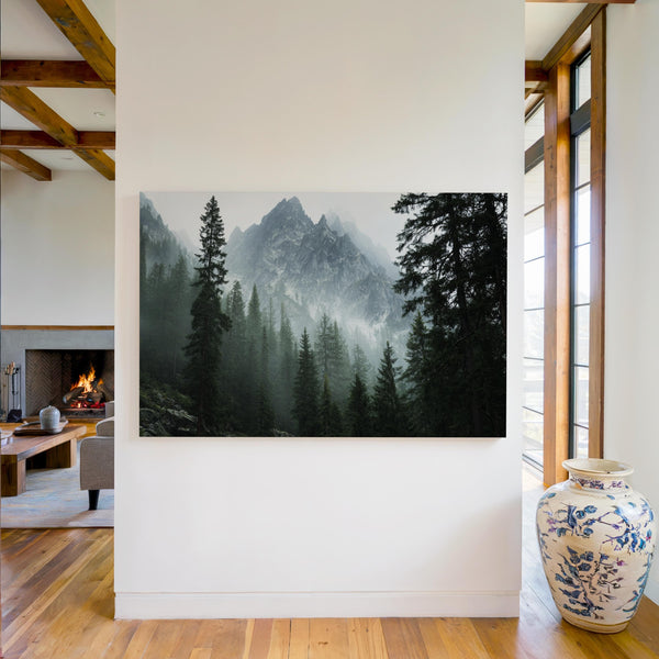 Canvas wall art of alpine evergreens and misty mountains. A tranquil landscape print that brings calm and nature indoors. Ready to hang.