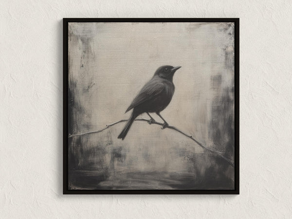 Canvas wall art of a solitary blackbird on a wintry branch. A peaceful monochrome bird print, ready to hang.