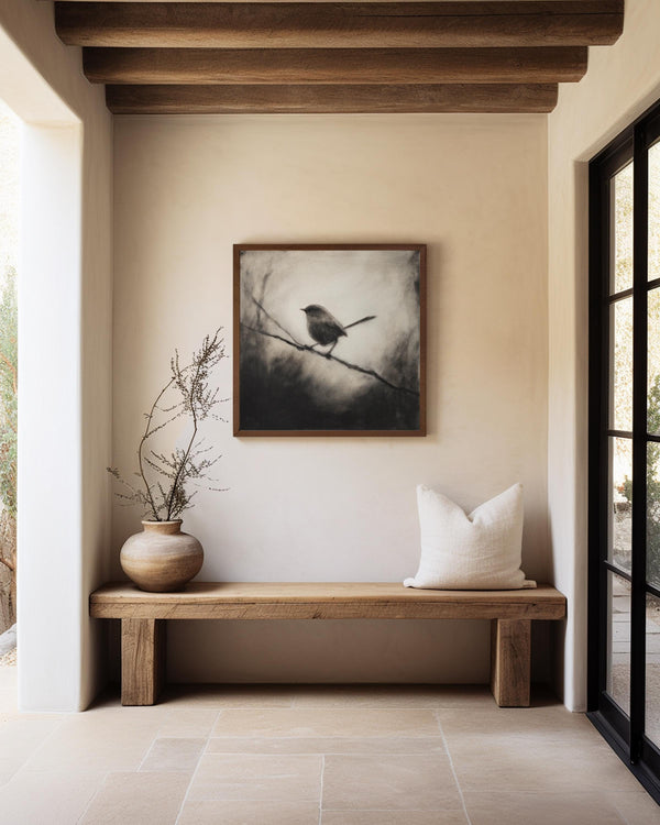 Canvas wall art of a solitary robin in black and white. A peaceful charcoal bird print, full of stillness. Ready to hang.