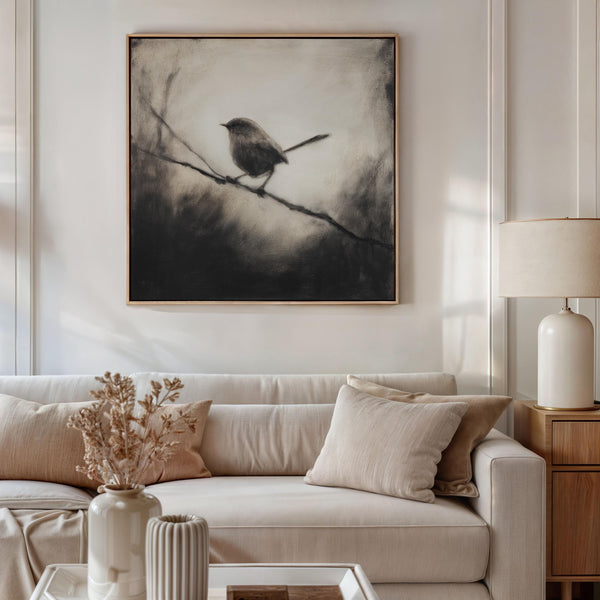 Canvas wall art of a solitary robin in black and white. A peaceful charcoal bird print, full of stillness. Ready to hang.