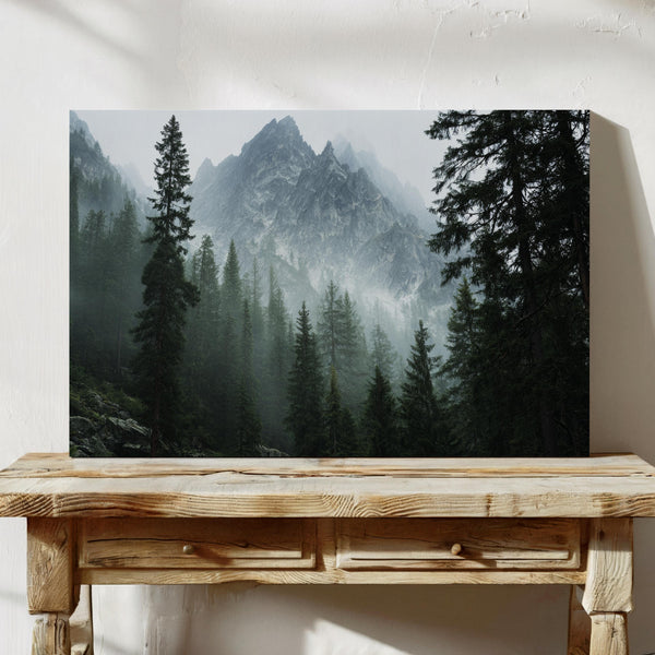 Canvas wall art of alpine evergreens and misty mountains. A tranquil landscape print that brings calm and nature indoors. Ready to hang.