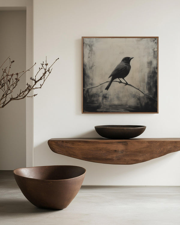 Canvas wall art of a solitary blackbird on a wintry branch. A peaceful monochrome bird print, ready to hang.