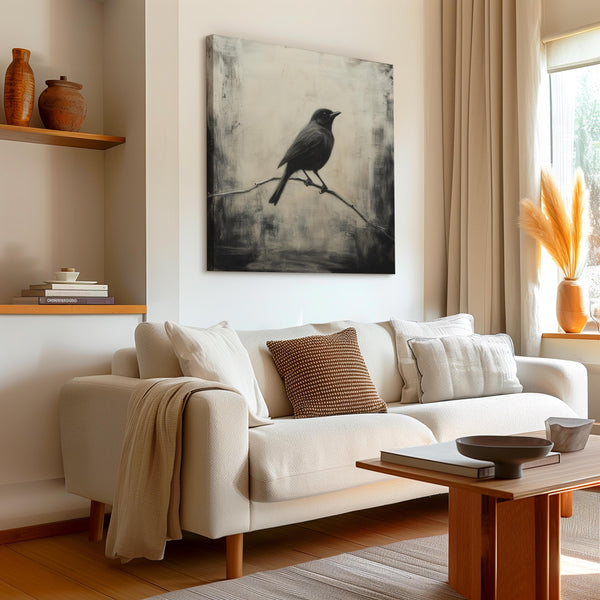 Canvas wall art of a solitary blackbird on a wintry branch. A peaceful monochrome bird print, ready to hang.