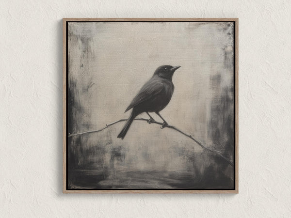 Canvas wall art of a solitary blackbird on a wintry branch. A peaceful monochrome bird print, ready to hang.