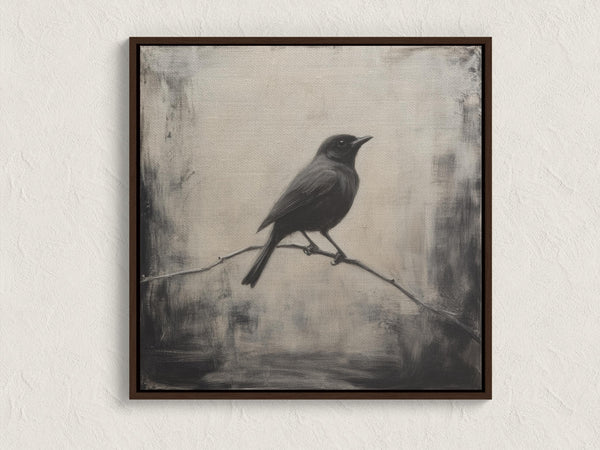 Canvas wall art of a solitary blackbird on a wintry branch. A peaceful monochrome bird print, ready to hang.