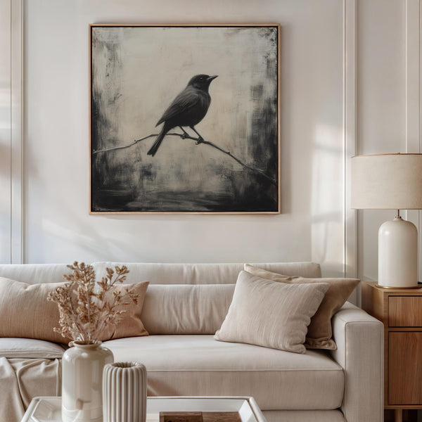 Canvas wall art of a solitary blackbird on a wintry branch. A peaceful monochrome bird print, ready to hang.